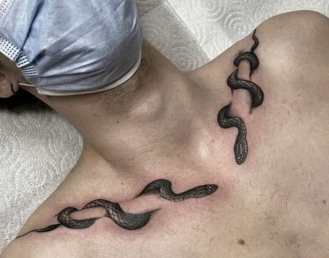 Snake Through Collar Bone Tattoo, Hot Collar Bone Tattoo, In Between Collar Bone Tattoo, Chest Bones Tattoo, Snake Collar Bone Tattoo For Men, Man Collarbone Tattoo, Wrapped Collar Bone Tattoo, Tattoo Designs Men Collar Bone, Snake Tattoo Around Collar Bone