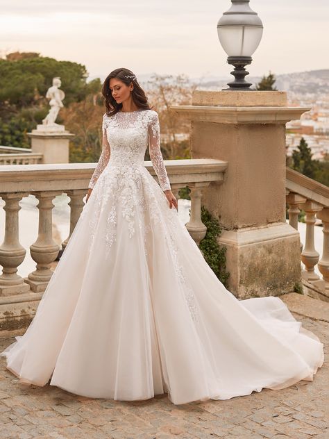 Princess wedding dress with boat neckline, long sleeves and transparent back Lace Wedding Dress With Sleeves A Line, Simple And Classic Wedding Dress, Hoop Skirt Wedding Dress, Lacy Modest Wedding Dresses, Champagne A Line Wedding Dress, Dreamy Wedding Dress With Sleeves, Princess Lace Wedding Dress, Elegant Bridal Gowns Classy, Disney Inspired Wedding Dress