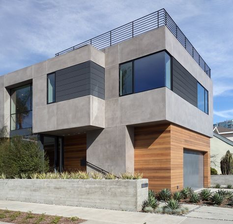 Modern home with Exterior, House, Flat RoofLine, Wood Siding Material, Metal Siding Material, and Stucco Siding Material. Front Corner View Photo 2 of Oxford Residence Concrete And Wood House Exterior, House Concrete Exterior, Concrete And Wood Facade, Cement Homes Exterior, Modern Stucco House Exterior, Modern Exterior Materials, Stucco Exterior Colors Modern, Stucco And Wood Exterior, Corner House Design Exterior