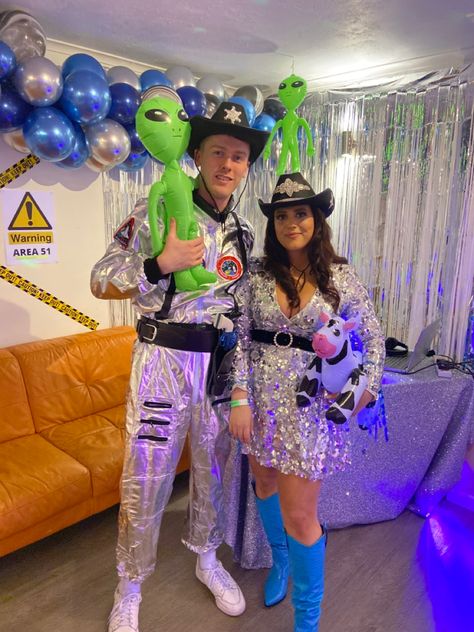 Space Cowboy Party decoration and costume inspiration #spacecowboy #decorations #costume #spacecowboycostume Space Cowboy And Alien Costume, Space Cowgirl And Alien Costume, Space Cowboys Couple Costume, Space Themed Couples Costume, Space Cowboy Wedding Theme, Space Cowboy Halloween Costume, Cowboy And Alien Costume, Cosmic Cowboy Costume, Space Cowboy And Cowgirl Couple Costume