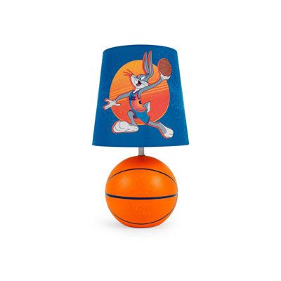 Call for "Lights, Camera, Action!" with this Space Jam table lamp. Straight from space jam: A new legacy starring LeBron James, this basketball-shaped lamp can give you a home-court advantage. Inspired by the sports comedy sequel, the lampshade depicts Bugs Bunny going up for a dunk. When you are ready for game time, turn on the lamp via the polarized electric plug. The energy-efficient LED bulb (included) will light up your bedroom, game room, office, and other spaces. I tell ya, Bugs, nothing Boys Space Bedroom, Basketball Theme Room, Space Jam Theme, Dj Room, Space Jam A New Legacy, Black Bedside, Hangout Room, Tune Squad, Basketball Theme