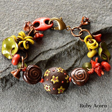 Put this on and throw a party!  Add happiness to your day with this gorgeous unique beaded bracelet!  Handmade with love using only the finest components, including: artisan ceramic beads, artisan lampwork glass beads, artisan enameled flowers and double-hole link, lampwork glass teardrop, Czech glass flowers, olive rubber rings, burnt orange waxed Irish linen cord, antique brass finish jump rings, antique brass finish lobster claw, antique brass finish headpins.   Fiesta Bracelet measures . . . about 7 1/4" A must have for your lovely wrist!  Truly one of a kind art you can wear.  There isn't another bracelet like this out there.  Unique and beautiful, just like you!  Packaged carefully and ships quickly. 2000 Bracelet, Czech Glass Bead Bracelet, Rings Antique, Artisan Bracelets, Beautiful Bracelets, Rubber Rings, Handmade Lampwork Bead, Throw A Party, Glass Bracelet