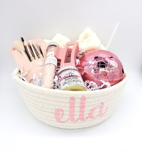 Spa Gift Basket This fabric woven basket is packed full of spa treats! Perfect for teens to adults!   The basket can be personalized with a name! How sweet! Fabric Spa Basket ♥-Fun Pink Disco Cup with Straw ♥-Bella and Bear Sugar Scrub ♥- Hair Clip ♥- Spa Headband ♥- Lavendar Bath Salt ♥- Set of Make-up brushes Bella and Bear Sugar Scrub ♥Vegan, No Parabens, No Phthalates, No GMOs, Food Safe Colors, Plant-Based,  Recycled Plastic, Reusable Packaging Skin-sational - body scrub exfoliator and shower gel infused with a fresh delicate tropical, fruity scent. NATURAL Lavender Bath Salts ♥*LAVENDER- Organic and premium Epsom salt, Himalayan salt, and pure essential oils. The salts come in a cute test tube for easy pour for your next relaxing soak. **Thank you for supporting my small business Spa Basket, Lavender Bath Salts, Hygge Gifts, Spa Gift Basket, Reusable Packaging, Spa Headband, Sending Love, Sending Hugs, Spa Gift