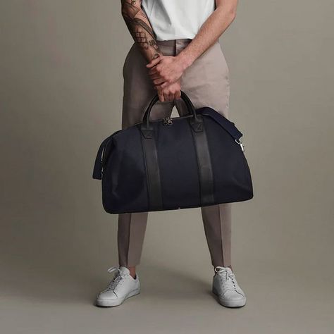 This year, we're eagerly plotting weekend jaunts to the countryside and road trips along the coast. We're packing all manner of essentials – from smart-casual white sneakers to an ever-versatile overshirt, but at the top of our wish list is a trusty holdall to throw it all into. Enter the weekender – the ultimate travel companion that will carry all you need for those 48-hour trips. The best men's weekender bags fuse style, space efficiency and sturdiness: Invest well and your weekender will out Mens Carry On Bag, Mens Travel Essentials, Mens Duffel Bag, Mens Overnight Bag, Casual White Sneakers, Mens Duffle Bag, Weekend Duffle Bag, Mens Gym Bag, Mens Weekend Bag