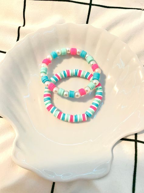 Hi, I am a small business owner and I am hand making these clay bead bracelets. They are very good quality,preppy and fashionable. I have a bracelet tiktok (@BeadsByBrynlie) account where you can see a lot of my creations. Please message me with any questions and to personalize your new bracelets today! Fimo, Cute Handmade Bracelets Beads, Lilo And Stitch Clay Bead Bracelets, Clay Bead Bracelets With Charms, Cute Bracelet Ideas Glass Beads, Preppy Bracelets Ideas Clay Beads, Clay Bead Preppy Bracelet Ideas, Starting A Bracelet Business, Cute Summer Clay Bead Bracelet Ideas