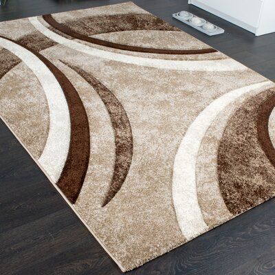 Looking for a modern focal point for your living room, bedroom, kitchen, or hallway? Then this designer rug from our current collection is perfect. The color combination, exclusive pattern, intense color brilliance, and contours created by hand make this woven rug an elegant highlight in any home. And for a short pile, it's a real bargain. Rug Size: Rectangle 2' x 3'7" | Brown Area Rug - Orren Ellis Malawi Abstract Area Rug Polypropylene in Brown, Size 24.0 W x 0.47 D in | Wayfair Brown Sofa Living Room, Beige Living Rooms, Brown Carpet, Abstract Area Rug, Tapis Design, Sofa Set Designs, Brown Furniture, Rug Brown, Brown Living Room