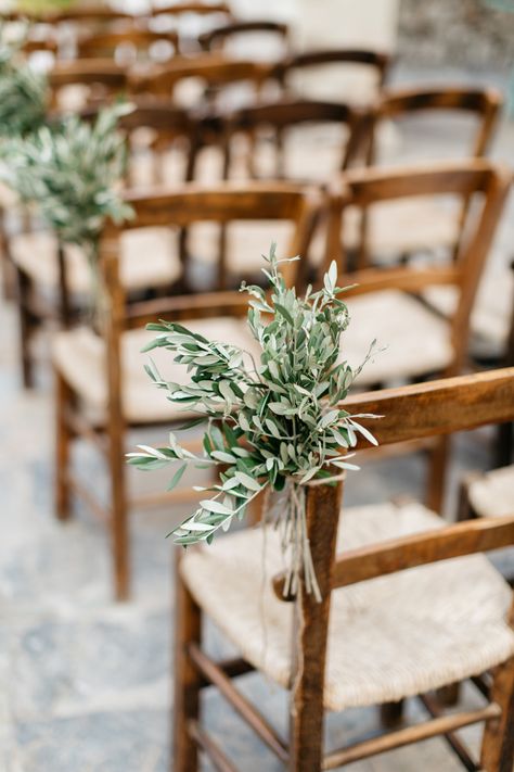 Chair Greenery Wedding, Simple Isle Wedding Decor, Greenery On Chairs Wedding, Flowers On Wedding Chairs, Ferns Down Wedding Aisle, Chair Wedding Flowers, Wedding Chair Greenery, Isle Greenery Wedding, Mismatched Wooden Chairs Wedding