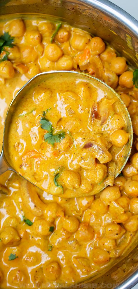 Creamy Coconut Chickpea Curry Recipe - lightly spiced prepared with coconut milk, this vibrant and wholesome curry is sure to make you feel amazing. This is a one pot vegan dinner meal idea inspired by Indian curries. www.MasalaHerb.com Coconut Curry Chickpea Soup, Chickpeas Curry Coconut Milk, Paneer And Chickpea Curry, Chickpeas Coconut Milk, Coconut Bean Curry, Chickpea And Coconut Milk Recipes, Chickpea Stew Coconut Milk, Chick Pea Recipes With Coconut Milk, Butter Chickpeas Vegan