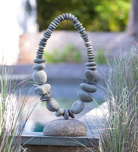 This River Stone Oval garden sculpture makes a wonderful statement piece for the home that appreciates the natural beauty of river rock. The metal inner construction is a sturdy base for the large river stones arranged in an oval design. Each sculpture is handcrafted and no two are identical. Ethereal design makes this sculpture perfect for both an indoor or outdoor setting. V5148,River Stone Oval Garden Sculpture on Stand, oval garden sculptures,river stone,rive 3d Rock Art, Rock Sculptures Garden Stone Art, Rock Art Ideas River Stones Diy Projects, Rock Art Ideas River Stones, Stone Arrangement, River Stones Crafts, Stone Sculpture Art, Rock Crafts Diy, Stone Balancing