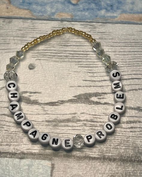 Champagne Problems stretch friendship bracelet. The bracelets are sized to be plus sized friendly. #taylorswift #swifties #friendshipbracelets #plussize #crochet #knitting #stitchmarkers Friendship Bracelets, Champagne Problems Bracelet, Champagne Problems, Plus Sized, Crochet Knitting, Stitch Markers, Friendship Bracelet, New Items, You Think