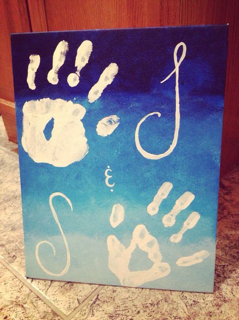 Using a canvas board, I took a damp sponge and started with a dark blue paint, mixing it with white as I worked my way down the board. I was attempting to give it an ombré look. Then my boyfriend and I painted our hands white and stamped them on the board, and I painted our first initials beside of our hands. It was really easy and a cute idea! Couples Handprint Art, Painting With My Boyfriend, Paintings To Make With Boyfriend, Couple Easy Painting Ideas, Canvas Hand Painting Couples, Boyfriend And Girlfriend Hand Painting, Couples Painting Ideas Canvases Hands, Marriage Painting Ideas, Cute Paintings To Do With Boyfriend