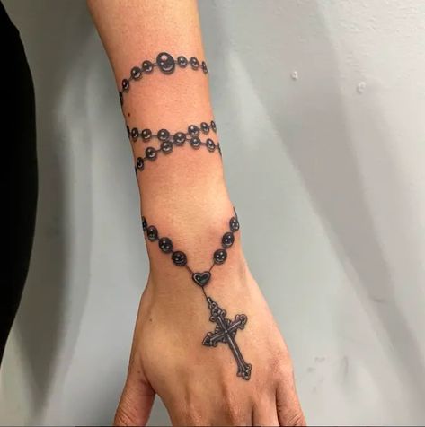 41 Divine Rosary Tattoo Designs: Channeling Spiritual Elegance in Ink - Psycho Tats Black And Grey Rosary Tattoo, Pearl Bracelet Tattoo Wrist, Rosary Tattoo With Flowers, Turtle Bracelet Tattoo, Rosery Tattoos On Arm, Rosary Bead Tattoo For Men, Virgo Tattoo Stars, Rosery Tattoos On Hand Women, Forearm Rosary Tattoos For Women