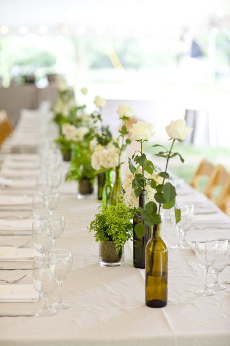 8 Wedding Wine Bottle Centrepiece Decor Ideas | Just Wine Wine Bottle Wedding Decor, Wine Bottle Wedding Centerpieces, Greenery Wedding Centerpieces, Wine Bottle Vases, Wine Bottle Centerpieces, West France, Wedding Wine Bottles, Bottle Centerpieces, Wedding Bottles