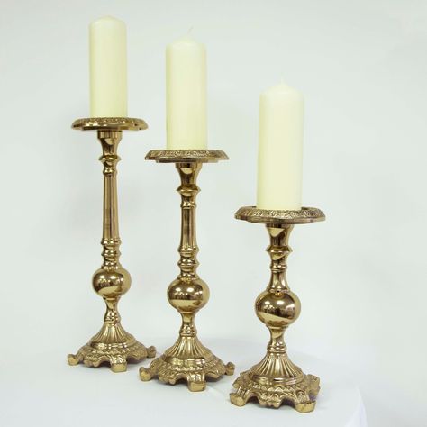 Introducing our Pillar Candle Holder Set in Antique Gold, a collection of three sizes for versatile and elegant candle displays. Large Holder: Dimensions - Bottom Width: 12cm, Top Diameter: 12cm, Height: 42cm Medium Holder: Dimensions - Bottom Width: 12cm, Top Diameter: 12cm, Height: 37cm Small Holder: Dimensions - Bottom Width: 12cm, Top Diameter: 12cm, Height: 27cm All holders are designed to perfectly fit 8cm pillar candles. Elevate your home decor with these antique gold candle holders, each Antique Gold Set, Elegant Candle, Gold Candle, Elegant Candles, Gold Candle Holders, Pillar Candle Holder, Wedding Event Decor, Candle Displays, Gold G