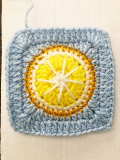 Lemon Granny Square ABBREVIATIONS MG - Magic Ring CH - Chain SC - Single Crochet HDC - Half Double Crochet DC - Double Crochet SS - slip stitch SUPPLIES NEEDED: •4 Colors of yarn(medium/4) -Color 1- White(preferably w/sparkle) -Color 2- Light Yellow -Color 3- Bright Yellow -Color 4- Blues •Size G crochet hook •Scissors •Crochet needle for hiding ends • start with a MG • Row 1(using color 1) - 12 SC I to MG, close ring with a SS through the first SC dropping color 1 an Amigurumi Patterns, Crochet Lemon Granny Square, Lemon Granny Square Crochet, 2 Color Granny Square Crochet, Lemon Granny Square, Blue Granny Squares, Crochet Granny Square Throw, Crochet Hdc, Crochet Needle