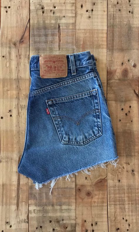 "High waisted 90s denim shorts. Made by Levi's in dark blue denim wash. Shorts are in great clean condition. Perfectly worn in with great naturally distressed character. These have been cut off and washed once.  Measurements are taken zipped or buttoned up and laid comfortably flat then x 2 for total circumference (inches) Tag Size 31 Levis 505 100% Cotton ~Measure Rise First~ Waist 30\" Hips 41\" Length 12.5\" Inseam 2.5\" Rise 11.5\" leg opening circumference 23\" All items are free of rips, t Levis Cutoff Shorts, Jean Shorts Levis, Thrifting Outfits, Thrifting Manifestation, 90s Denim Shorts, Short Levis, Dark Jean Shorts, Levi Denim Shorts, Jean Cutoffs