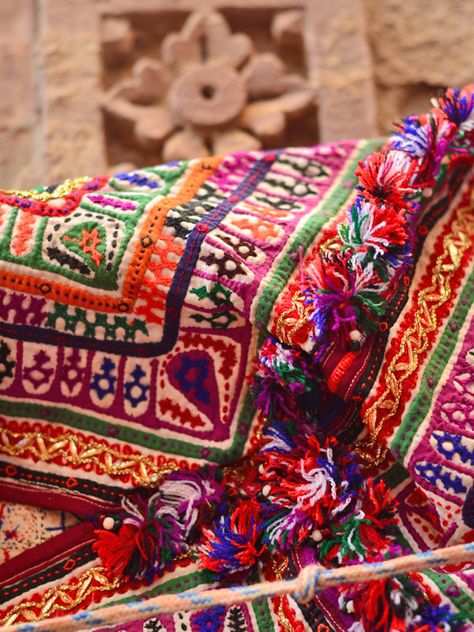Banjara embroidery, Rajasthan  https://www.whatsuplife.in/delhi/blog/handicrafts-handloom-stores-showrooms-shopping-delhi/#prettyPhoto Cross Stitching, Camel, Rajasthan Embroidery, Fair Festival, Textile Embroidery, India Textiles, Halloween Outfits, Embroidered Friendship Bracelet, Crochet Blanket