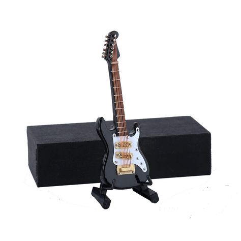 PRICES MAY VARY. Very detailed miniature replica of guitar(Non Playable Simulate Instrument) Approx.Size:3.92"x1.24"x0.37" // 9.96cm x 3.16cm x 0.93cm Material:Wooden,String Configuration:6 String Including: 1x Guitar Miniature,1x Stand,1x Case. Nice gift for families and friends.Also fit for Action Figures and Dolls. This High-quality Handcrafted Miniature Guitar is completely detailed with strings,tuning pegs,frets,and wooden body.  With different size:3.92"x1.24"x0.37" // 9.96cm x 3.16cm x 0. Musical Instruments, Model Birthday, Miniature Guitars, Dollhouse Christmas, Miniature Dollhouse, Musical Instrument, Birthday Present, Birthday Presents, Dollhouse Miniatures