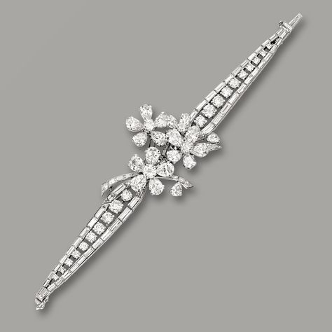 Diamond Bracelet, Van Cleef & Arpels The centre designed as three flowerheads, completed by a tapered strap set with brilliant-cut and baguette diamonds together weighing approximately 16.00 carats, mounted in platinum, signed VCA and numbered G375, Van Cleef And Arpels Bracelet, Diamond Bracelet Design, Van Cleef And Arpels, Diamond Necklace Designs, Jewelry Advice, Jewelry Bracelets Silver, Bracelets Gold Diamond, Diamond Jewelry Designs, Baguette Diamonds