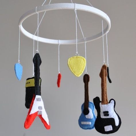 Some kids have animals hanging from their mobile, but yours will have guitars, picks, and amps. Baby Health, Music Nursery, Diy Music, Diy Bebe, Real Moms, Rock Baby, Music Themed, Crib Mobile, Baby Boy Rooms