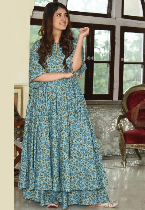 Readymade Muslin Cotton Flared Kurta in Blue This Round Neck and Elbow Sleeve attire with Faux Crepe Lining is Prettified with Floral Print Available with a Muslin Cotton Palazzo in Blue Do note: The Length may vary upto 2 inches. Accessories shown in the image are for presentation purposes only.(Slight variation in actual color vs. image is possible). Kurtis Latest, Sky Blue Suit, Blue Kurti, Plazo Set, Kurti With Palazzo, Angrakha Style, Indian Kurti, Latest Kurti, Kurti Designs Latest