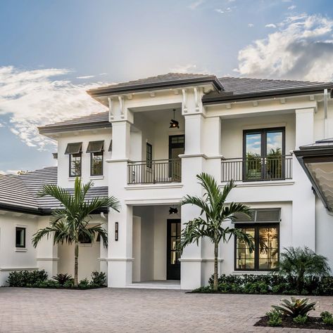 This gorgeous coastal-style residence was designed by Divco Custom Homes along with Design West, located in the luxurious Grey Oaks community of Naples, Florida. Dream Beach Houses Exterior, Coastal Homes Exteriors Florida, Modern Coastal Home Exterior, Florida House Exterior, Beach Modern House, Florida Homes Exterior, Coastal House Exterior, Florida Style Homes, Coastal Home Exterior