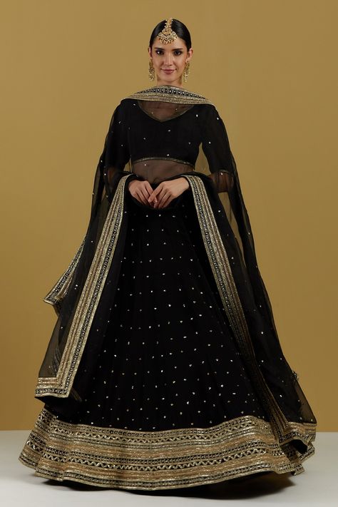 Black dupatta in a organza base with sequin and bugle beads embroidery on the border and scattered in the centre. Component: 1 Pattern: Embroidery Type Of Work: Sequin and Bugle Beads Fabric: Organza Color: Black Other Details:  Note: The lehenga and blouse worn by the model is not for sale Occasion: Sangeet - Aza Fashions Black Lengha Blouse Designs, Black Lehenga Look, Black Lehnga Dress, Black Lehenga Designs, Lehnga Simple, Ikshita Choudhary, Lehenga Trending, Black Lengha, Black And Gold Lehenga