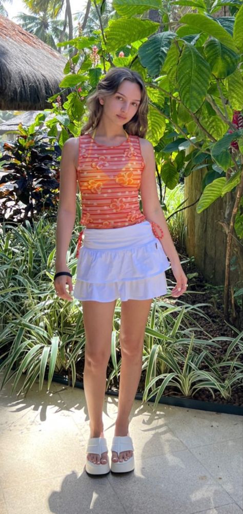 white tennis skirt with orange mesh top Orange And White Skirt Outfit, Orange Skirt Outfit Ideas, Orange Skirt Outfit, Outfit Recreation, White Skirt Outfit, Eras Outfit, White Skirt Outfits, Skirt Outfit Ideas, White Tennis Skirt
