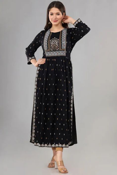 1. Elevate your ethnic wardrobe with this stunning black embroidered kurta featuring intricate embroidery on the sleeves. Made from high-quality rayon fabric, this kurti offers both style and comfort, making it a versatile piece for any occasion. Add a touch of elegance to your look with this timeless piece that is sure to turn heads wherever you go. COLOR :- AS PER SELECTION PRODUCT DESCRIPTION: Quality: 100 % Gauranteed Style: Salwar Kameez Work: Printed Material: Cotton Stitched: Yes Full Stitched Nayra Cut Dresses Design Kurti, Nayra Cut, Black Salwar, Black Salwar Kameez, Black Kurti, Style Kurti, Black Attire, Gown Suit, Anarkali Kurta