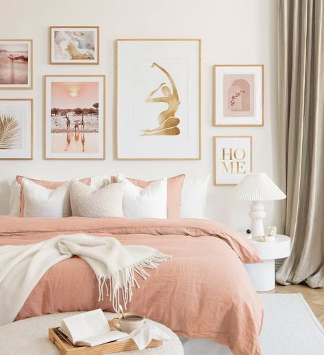 A gallery wall with soft pink and beige tones in oak frames creates a harmonious ambience in your bedroom. White Pink Beige Bedroom, Cosy Pink Bedroom, Teen Pink Bedroom Ideas, Pink Adult Bedroom Ideas, Blush And Cream Bedroom, Blush Pink Bedroom Ideas For Women, Peach Room Aesthetic, Pink And Cream Bedroom, Neutral Pink Bedroom