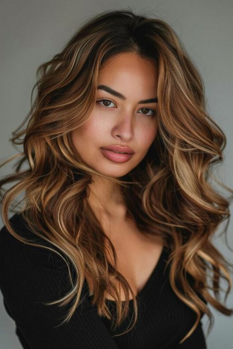 Portrait of a young woman with wavy, caramel-blonde hair and a neutral expression. Balayage, Highlights On Dark Brunette Hair, Carmel Hair Highlight, Honey Blonde Brown Balayage, Lived In Caramel Balayage, Caramel Hair Dark Roots, Kim Kardashian Caramel Hair, Ombre Hair Color For Brunettes Medium Length, Melted Caramel Hair