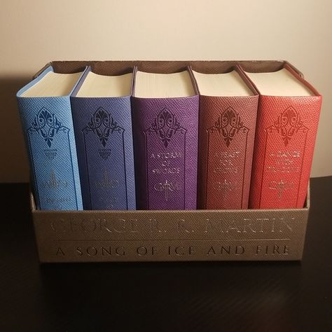 Leather back Game of Thrones book collection Asoiaf Book Covers, Game Of Thrones Books Aesthetic, Game Of Thrones Book Cover, Shelf Aesthetic, Game Of Thrones Collection, Bookworm Things, Genre Of Books, Game Of Thrones Books, Unread Books