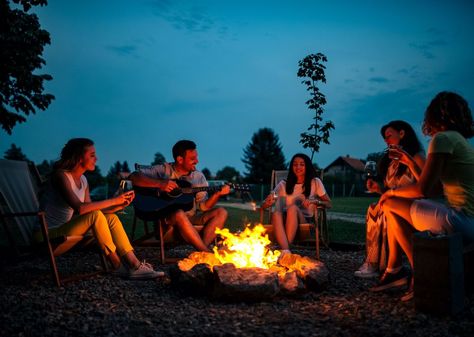 The best bonfire songs to sing with a guitar and friends include “House of the Rising Sun,” “Time of Your Life,” “Hotel California,” and Toto’s “Africa.” Summer Bonfire, Learn Guitar Songs, Campfire Songs, Camp Songs, Camping Friends, House Of The Rising Sun, Learn To Play Guitar, Hotel California, Astral Travel