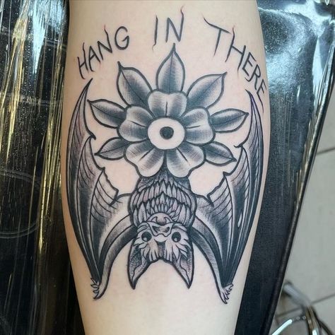 Hang In There Bat Tattoo, Bat Tattoo Under Knee, Bat Hanging Tattoo, Bat Tattoo With Flowers, Modern Flash Tattoo, Spooky American Traditional Tattoo, Hang In There Tattoo, Floral Bat Tattoo, Trad Bat Tattoo