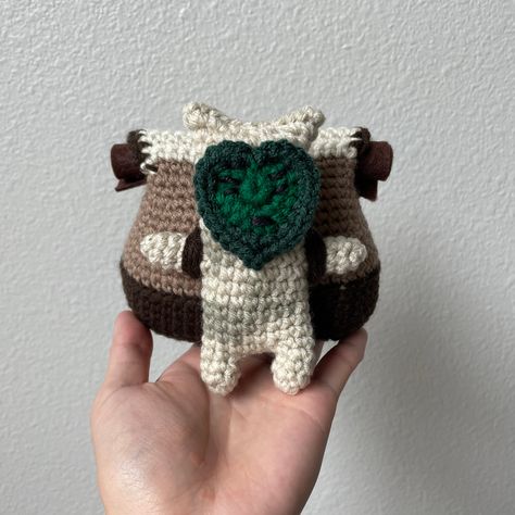 If you’ve been playing Legend of Zelda Tears of the Kingdom, then you’ve probably encountered some of these backpack Koroks. These little Koroks carry backpacks that are much bigger than their bodies and as a result, they’re slowed down by the weight and get separated from their travel companion, and it’s Link’s job to Amigurumi Patterns, Link Carrying Zelda, Zelda Totk Crochet, Link Crochet Pattern Zelda, Free Zelda Crochet Pattern, Crochet Zelda Pattern, Video Game Amigurumi, Legend Of Zelda Crochet Pattern Free, Korok Crochet Pattern Free