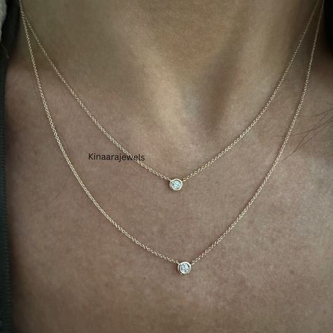 ● KINAARA JEWELS ●  Diamond Solitaire Necklace Minimal Gold Necklace Lab Grown Diamond Necklace Dainty Bezel Necklace Layering Necklace Bezel Set Tiny Necklace ● Alternative names of Lab Grown Diamonds are 𝐂𝐕𝐃, 𝐇𝐏𝐇𝐓, 𝐆𝐫𝐞𝐞𝐧 𝐃𝐢𝐚𝐦𝐨𝐧𝐝, 𝐄𝐭𝐡𝐢𝐜𝐚𝐥 𝐝𝐢𝐚𝐦𝐨𝐧𝐝, 𝐄𝐜𝐨-𝐅𝐫𝐢𝐞𝐧𝐝𝐥𝐲 𝐃𝐢𝐚𝐦𝐨𝐧𝐝, 𝐄𝐚𝐫𝐭𝐡𝐅𝐫𝐢𝐞𝐧𝐝𝐥𝐲 𝐃𝐢𝐚𝐦𝐨𝐧𝐝. ● 𝐂𝐞𝐧𝐭𝐞𝐫 𝐃𝐢𝐚𝐦𝐨𝐧𝐝 𝐃𝐞𝐭𝐚𝐢𝐥𝐬 → Type: Lab Grown Diamond → Shape: Round Cut → Carat: 2 MM, 3 MM → Color: EF → Clarity: VS ⬗ 𝐄𝐚𝐬𝐲 𝐏𝐚𝐲𝐦𝐞𝐧𝐭 𝐏𝐥𝐚𝐧 ⬗ ➺ Minimum 200 USD Order Value. ➺ Production Start After 50% Payment. ➺ Jewelry Shipp After Full Payment Received. ❤ More of my Unique Necklace ❤ https://www.etsy.com/in-en/shop/Kinaarajewels?ref=seller-platform-mcnav ●  Kinaarajewels Services/Notes  A. Handmade Simple Diamond Necklace Designs, Minimal Gold Necklace, Diamond Necklace Simple, Tiny Necklace, Alternative Names, Diamond Necklace Designs, Bezel Necklace, Solitaire Necklace, Simple Diamonds