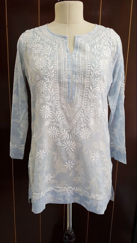 Softest Mulmul short Kurta has a lace trim neckline and is defined by gorgeous chikankari hand embroidery. Our Bestselling Cornflower Blue Floral Print in Soft Mulmul Fabric Length - 30/31 inches Machine wash, Line dry and light iron for best results. Preshrunk. Size - S - fits bust 34 M - fits bust 36 L - fits bust 38 XL - fits bust 40 0X - fits bust 42 1X - fits bust 44 2X - fits bust 46 3X - fits bust 48 Sleeveless Kurta, Short Kurta, Indian Aesthetic, Hand Embroidery Design, Blue Floral Print, Beautiful Blouses, Cornflower Blue, Top Photo, May 21