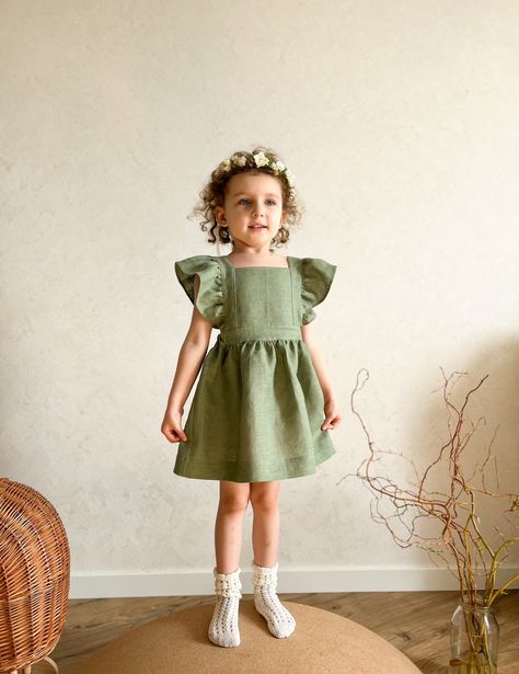 "Flower girl dress, sage green linen dress toddler, junior bridesmaid ruffled kids gown, pinafore dress toddler, baptism dress kids fall photoshoot baby This gorgeous linen flower girl dress made of high quality 100% European linen,  OEKO - certified. The dress will be made on order especially for your girl in any color and size. It is perfect for birthday party, summer photo shoot or as wedding flower girl dress. SIZE CHART: Newborn / height 56cm (22\") 3 months / height 62cm (24.4\") 6 months Toddler Baptism Dress, Pinafore Dress Toddler, Green Toddler Dress, Toddler Baptism, Dress Sage Green, Linen Flower, Green Linen Dress, Dress Photoshoot, Sage Green Dress