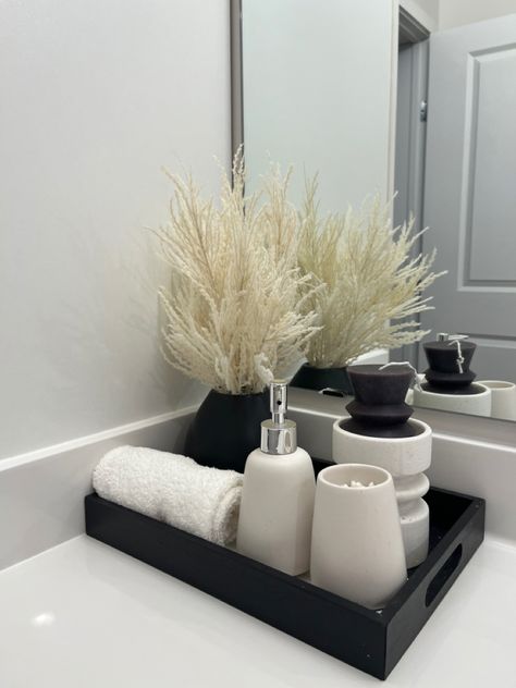 #bathroomdecorideas #bathroom #bathroomdecoration #aesthetic #pampas #black #beige #neutral #neutralhomedecor Bathroom Inspo Rental, Neutral And Black Bathroom Ideas, Neutral Apartment With Black Accents, Black And White Bathroom Counter Decor, Black And Gold Bathroom Aesthetic, Black And White Master Bath Decor, Sleek Black Home Decor, Black And White Bathroom Decor Ideas Modern, Beige And Black Bathroom Decor