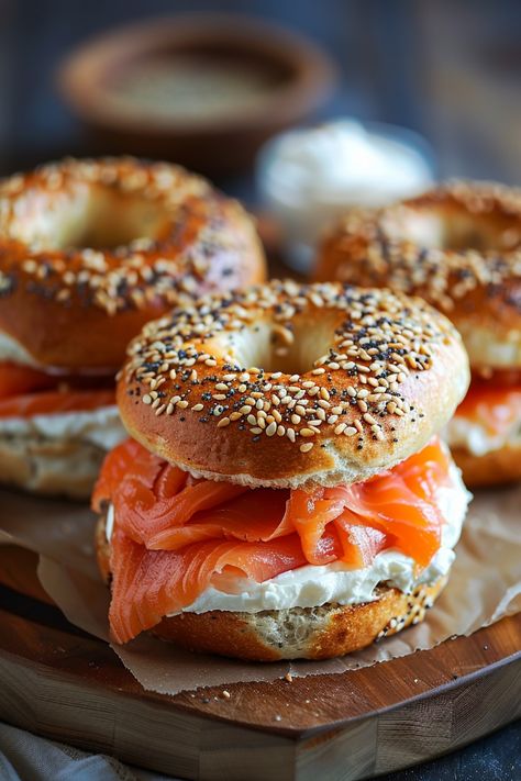 Bagels topped with cream cheese and smoked salmon. Essen, Bagels With Salmon, Scallion Cream Cheese Bagel, Bagel With Cream Cheese And Salmon, Salmon And Cream Cheese Bagel, Bagel Cream Cheese Sandwich, Salmon Bagel Breakfast, Smoked Salmon Croissant, Bagel Breakfast Ideas