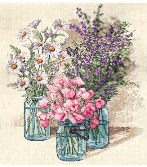 Use the Dimensions Wildflower Trio Counted Cross Stitch Kit to infuse your home interiors with floral bliss Featuring heather, sweet peas and daisies, bunched in vintage canning jars, this cross stitch kit has a design that exudes feminine charm and grace For heightened artistry, the background is worked in half cross stitch Brand: DimensionsTheme: Wildflower TrioIncludes 14 - count aida, cotton thread, thread palette, needle and instructionsDimensions: 11 x 12 inches Tela, Stamped Cross Stitch Kits, Cowboy Cross, Dimensions Cross Stitch, Cross Stitch Sea, Flower Cross Stitch, Stamped Cross Stitch, Floral Cross Stitch Pattern, Flower Cross