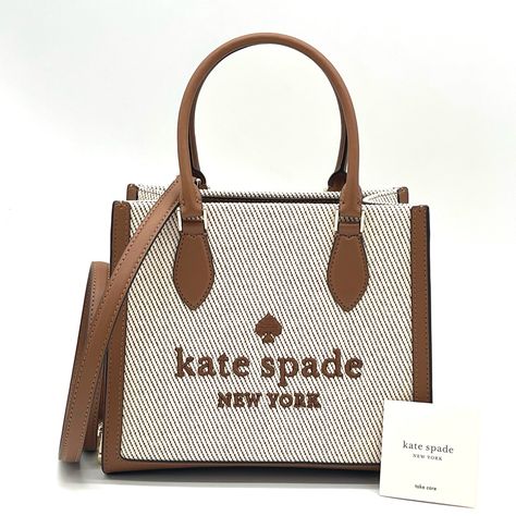 Brand New With Tag Kate Spade Small Ellie Tote Bag Product Details Measurements 8.2" H X 4.48" D 9.36"W (Bottom), 8.88"W (Top) Handle Drop: 5.0" Color: Warm Gingerbread Features Strap Drop: 22" Metal Pinmount Logo Closure Type: Magnetic Snap Closure Dust Bag Included: No Interior: Back Zip Pocket Materials Canvas Trim: Smooth Leather Lining: Two Way Script Logo Lining Imported Leather Work Tote, Mesh Tote Bag, Kate Spade Satchel, Kate Spade Outlet, Large Leather Tote Bag, Side Snap, Quilted Tote Bags, Black Leather Tote Bag, Kate Spade Totes