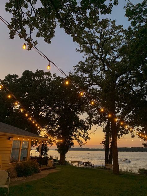 Beautiful lake sunset with string lights Porch View Aesthetic, House Beside Lake, Gothic Cottage Aesthetic, Old Lakehouse Aesthetic, Home By The Lake, Houses By The Lake, Outside Life Aesthetic, Cottagecore Lake House, Lake Resort Aesthetic
