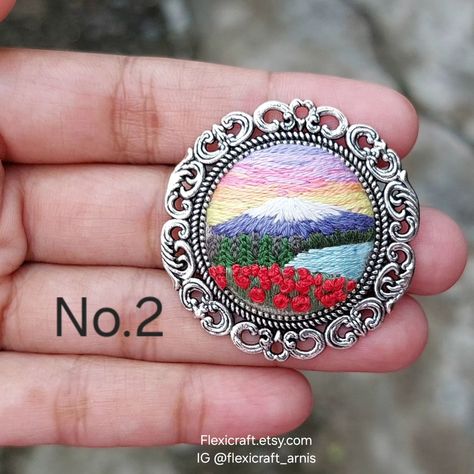 Landscape embroidered brooch, scenery hand embroidery pins, sunflower, lake, mountain Brooch size 1.25 inch Buy from my Etsy shop: flexicraft.etsy.com Full collections and tutorials Instagram.com/flexicraft_arnis Hand Embroidery, Scenery Embroidery, Embroidery Pins, Embroidered Brooch, Lake Mountain, July 4, Embroidery Art, Hand Embroidered, Brooches