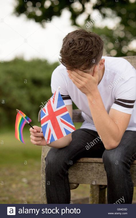 Stock image Man has his head in his hands with a british UK england flag and lgbtq+ rainbow flag. He is sufferinf Couple Poses Reference Funny, Business Man Stock Photo, People Drawing Poses, Mad Scientist Pose, Male Hourglass Shape, Couple Refrences Pose, Group Photos Funny, Cursed Couple Images, Strong Pose Reference