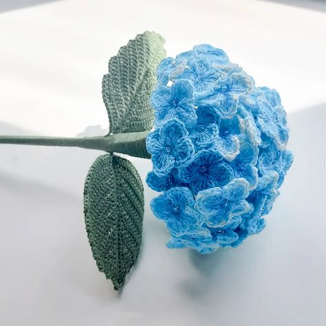 The hydrangea represents gratitude, grace, and beauty. Learn how to make some gorgeous hydrangeas with this tutorial. They look so realistic, and they'll never wilt on you! Amigurumi Patterns, Crocheted Hydrangea Flowers, Hydrangea Bouquet Crochet, Bouquet Of Flowers Hydrangea, Crochet Hydrangea Bouquet, Crochet Realistic Flowers, Hydrangea Crochet Pattern, Crochet Hydrangea Pattern Free, Realistic Crochet Flowers