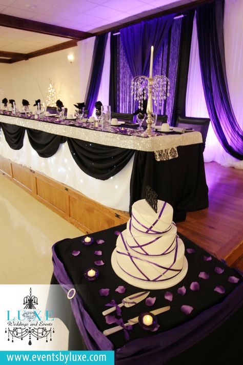 Purple black and white wedding backdrop,purple uplighting, purple black and… Black And Purple Reception Ideas, Black Purple And White Wedding, Purple Black Wedding Decorations, Black Purple White Wedding, Black White And Lavender Wedding, Purple And Black Quinceanera Ideas, Purple And Black Decor, Black And Purple Wedding Theme Wedding Table Decor, Purple White And Black Wedding