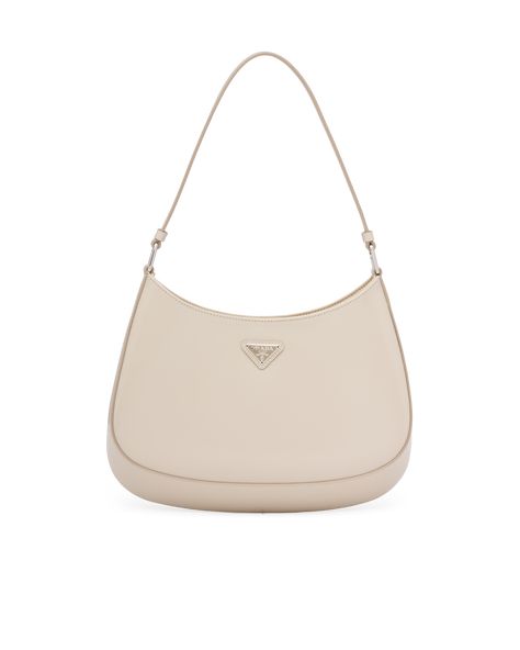 Brushed leather Leather handle Metal hardware Logo on enameled metal triangle at the front Magnet closure Prada logo nylon lining with patch pocket Prada Leather Shoulder Bag, Prada Cleo Bag, Cleo Bag, Beige Shoulder Bag, Prada Cleo, Round Shoulder Bag, Sacs Design, Hardware Logo, Prada Collection