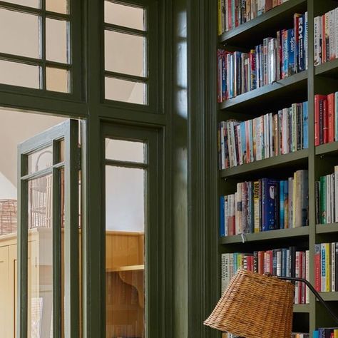 Sarah Brown on Instagram: "The tricky middle room in a Victorian terrace. We embraced the dark and created an atmospheric library space to house our clients’ large collection of books 📖 @farrowandball Bancha on the doors and joinery @snookphotograph" Corner Reading Nooks, Cosy Reading Corner, Library Space, Cosy Reading, Plush Couch, Restful Bedrooms, Sarah Brown, Deep Olive Green, Cozy Reading Corners