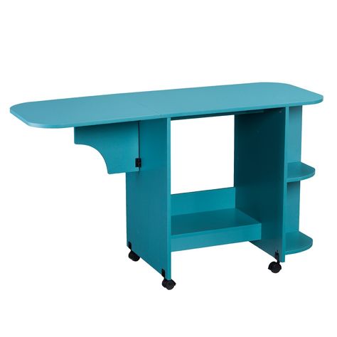 Let your creativity shine with the Aiden Lane Expandable Rolling Sewing Table/Craft Station. A spacious shelf and four cubbies provide storage for yarn, fabric swatches, or scissors, while a convenient drop-leaf tabletop expands or folds to fit your project. Roll this mobile organizer into your living space to create arts and crafts with the family, or station in your dedicated work area to keep sewing essentials and patterns neat and tidy. Bring order to your creative space with this versatile Turquoise Desk, Home Office Craft Room, Wood Desk Top, Sewing Desk, Campaign Desk, Sewing Machine Tables, Side Shelves, Room Supplies, Craft Station